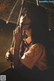 A woman holding an umbrella in the rain.